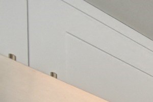 Kitchen with Granite Counters, Dishwasher, Oven, Microwave, Black/White Rug and White Cabinents